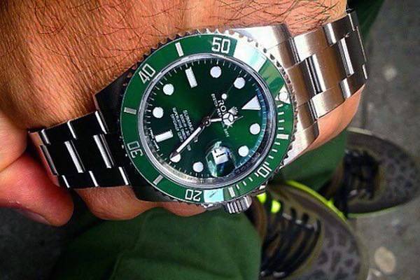 rolex submariner green on wrist