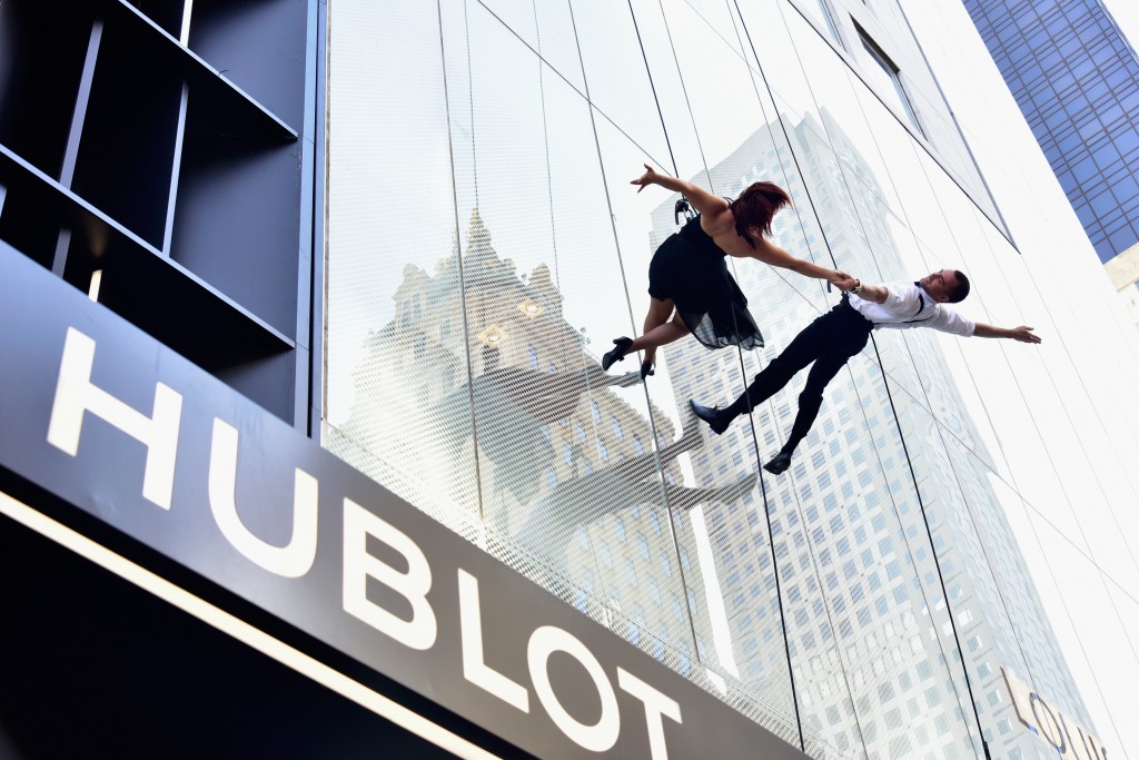 "NEW YORK, NY - APRIL 19: Dancers rappel down the facade of the Hublot Fifth Avenue Boutique during Hublot's celebration of the grand opening of it's Fifth Avenue Boutique in NYC on April 19, 2016 in New York City. (Photo by Eugene Gologursky/Getty Images for Hublot)"